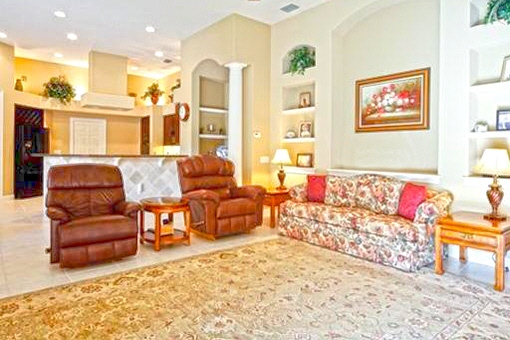 Cozy living room with sofa and 2 leather chairs